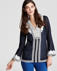 With a nod to '70s style, this Tory Burch tunic flaunts delicate embroidery and playful bell sleeves for a look that adds a touch of boho chic to your working wardrobe.