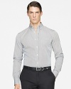 Rendered in smooth woven cotton for luxe comfort, a handsomely striped sport shirt is tailored for a trim, modern fit.