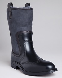 Rugged and sophisticated all at once, these rubber boots are perfect for a rough-weather workday: with a tall construction, faux shearling lining and wing-tip detailing, they keep your feet dry and warm yet look office-appropriate with your suit.