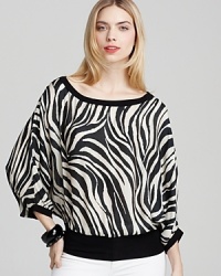 With a billowy silhouette and wild animal print, this Bailey 44 top goes from day to night in cutting-edge style.