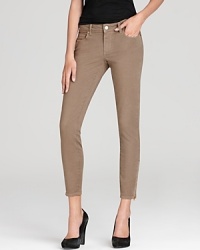 Shift into neutral with these fit to flatter, camel-colored skinny jeans that feature fun little ankle zips at the bottom for added versatility.