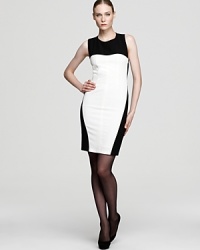 Make a memorable entrance and exit in this sleeveless standout that reveals an unexpected criss cross design in back.