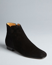 Bettye Muller gives these flat booties mod styling with inset heels, trim ankles and squared-off toes.