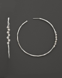 Faceted diamonds add gorgeous sparkle to slim sterling silver hoops. From the Silver Rain collection by Ippolita.