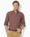 A handsome sport shirt is rendered in woven cotton with a preppy plaid pattern and relaxed fit for classic style.