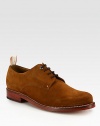 These lace-up oxfords in buttery soft suede exude effortless style, while an ankle pull-tab, with signature logo detail, provides maximum comfort and wearability.Suede upperLeather liningPadded insoleLeather soleImported