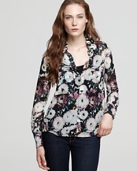 A lively floral print blooms upon this elegant silk button down.