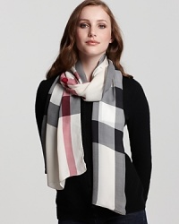 In soft, sheer silk, Burberry's Core Creppone check scarf lends a smooth finish.