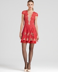 This festive, party-perfect BCBGMAXAZRIA dress lends a provocative optical illusion thanks to the mesh front inset and flaunts the lace trend (and obsession) of the season.