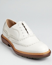 From garden parties to weekends away, this bold white wingtip finishes your look with a sense of classic casual style.