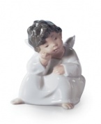 Thinking strictly warm and happy thoughts, this Lladro angel figurine watches over you and your loved ones with quiet grace.