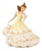 Whisk Belle from the ballroom, right into your home! Imprisoned no more, the kindhearted heroine from Beauty and the Beast radiates happiness in her billowing porcelain gown. Friends Mrs. Potts and Lumiere adorn the Disney collectible in radiant gold.