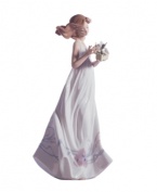 Enchanted by the quiet beauty of butterflies, this pretty young woman has a sense of sweet innocence in handcrafted porcelain. A classic figurine for the Lladro collector.