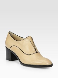 Timeless oxford in fine Italian leather with contrasting trim. Stacked heel, 2¼ (60mm)Leather upperLeather lining and solePadded insoleMade in ItalyOUR FIT MODEL RECOMMENDS ordering one half size up as this style runs small. 