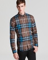 Burberry Brit empowers your casual wardrobe with a check plaid shirt that signifies the brand's heritage, crafted in crisp cotton and tailored for a modern fit.