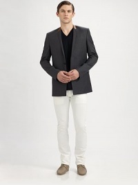 The next step in modern menswear: a blazer tailored from fine virgin wool with a concealed button closure and leather trim along the narrow lapel. Concealed two-button closureChest besom, waist flap pocketsFully linedAbout 29½ from shoulder to hemVirgin wool with lamb leatherDry cleanMade in Italy