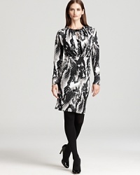 Infuse your 9-to-5 style with serious modern edge as a bold abstract print and bejeweled neckline update the essential Jones New York Collection dress.