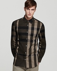 In a flattering palette of darker earth tones, the Treyforth sport shirt showcases Burberry's signature check print.