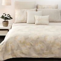 A textured dobby design of small diamonds, in coordinating colors that complement the beds.