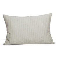 Alternating rows of slub yarns in cotton and linen give a natural, textural feel to this decorative pillow.