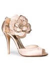 An oversized flower adorns the ankle strap of Stuart Weitzman's statement-making Bodabing pumps.