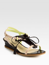 Lengthy tassel laces front playful patent leather straps, concluding with a slight self-covered wedge. Self-covered wedge, 1 (25mm)Patent leather upperLeather lining and solePadded insoleMade in ItalyOUR FIT MODEL RECOMMENDS ordering one half size up as this style runs small. 