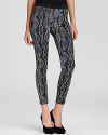 A mesmerizing snakeskin print slithers onto to these skinny French Connection pants for one of the most coveted and trendsetting looks of the season.