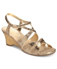 Shiny crisscrossing straps lend a hint of glamour to the Bakers Dozen sandals by Aerosoles.