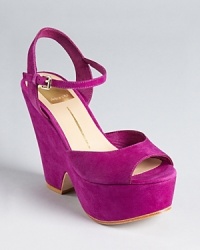 A cut-out wedge lends forward style to these chunky Dolce Vita platforms, on-trend in jewel tone suede.