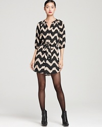 Aqua's shirt dress in abstract zebra print ensures standout style. Team with tights and booties for the office, or wear with flats to weekend brunch.