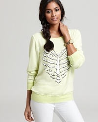 A heart-shaped skeleton makes a quirky statement on this electrically hued WILDFOX sweatshirt.