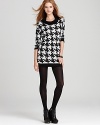 A tried and true classic print for fall, this bold houndstooth print enriches our versatile C&C California tunic--wear it with denim, leggings or tights.