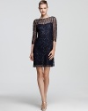 This exquisite Kay Unger lace dress is flecked with sparkling sequins for a dose of glamour.