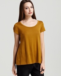 A vivid jewel tone lends luxe appeal to a classic Eileen Fisher tee. Set off the shade with golden accents and turn heads in brilliant color.