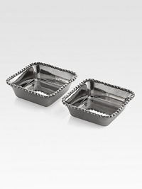 Stainless steel, polished to a high shine and accented with signature Molten edging.From the Molten CollectionStainless steelSet of 23.75W X 3.75L X 1.25HHand washImported