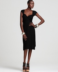 Nola Z puts an ever-flattering spin on the little black dress with a ruched bodice and sweetheart neckline. Layer bare arms with bangles for modern flair.