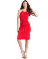 A necklace-like closure gives this radiant red halter dress a luxe look, amplified by the flattering fabric twist at the center of the waist. By Maggy London.