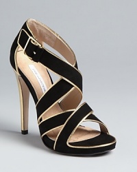 These DIANE von FURSTENBERG sandals play well day or night, with strappy uppers highlighted in gold.