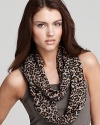 A lightweight loop scarf in a dark tan animal print, a fierce style from Fraas.