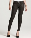 A shimmery python print lends an exotic touch to these J Brand skinny jeans.