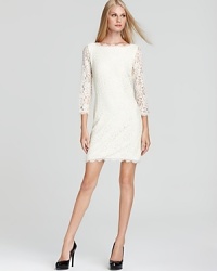 A ladylike DIANE von FURSTENBERG lace dress is ever-so chic for cocktails with an alluring v back and chic scalloped trim.