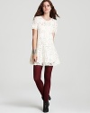 This Free People dress flaunts an ethereal look that combines the timeless beauty of lace with a flouncy, easy-to-wear silhouette--colorful leggings and a classic fall bootie give this look a modern edge.