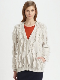 Allover fringe adds an unexpected touch to this lengthy, wool-rich topper with slash pockets and ribbed trim. V-neckButton frontLong sleevesSlash pocketsRibbed cuffs and hemLonger length hits below the hips55% wool/45% polyamideDry cleanImported of Italian fabricModel shown is 5'10 (177cm) wearing US size Small.