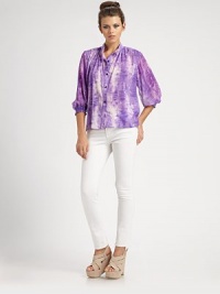 An easy-fit button-down shaped by soft pleats at the shoulders and gathered three-quarter sleeves, all in tie-dyed stretch silk.Band collarButton-down placketThree-quarter sleevesShirred cuffsShirttail hemBack yokeAbout 24 from shoulder to hem96% silk/4% spandexDry cleanImportedModel shown is 5'10 (177cm) wearing US size Small.