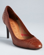 Burberry takes the oxford trend into neutral, streamlined high heel pumps with sleek rounded toes; leather contrasts shining logo heel accents.