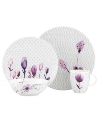 Blur the line between garden style and modern design with the Watercolors Amethyst saucer. Purple blossoms flourish against a playful dot pattern while the white coupe shape couples the sleek look and unparalleled durability of bone china. (Clearance)