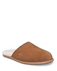 Suede mule style slipper, fully lined in sheepskin. Genuine sheepskin sockliner that naturally wicks moisture away and keeps your feet dry. Lightweight, sueded bottom with embossed logo.