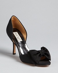 Bow, peep: these Badgley Mischka evening pumps feature elegant double bow details at each toe.