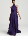 A high neckline lends a sophisticated look to Badgley Mischka's black tie-worthy gown, rendered in a rich and royal purple hue.