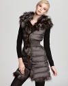 Flaunt fabulous style as the degrees drop with this oh-so-luxe fur-trimmed down vest from Dawn Levy.